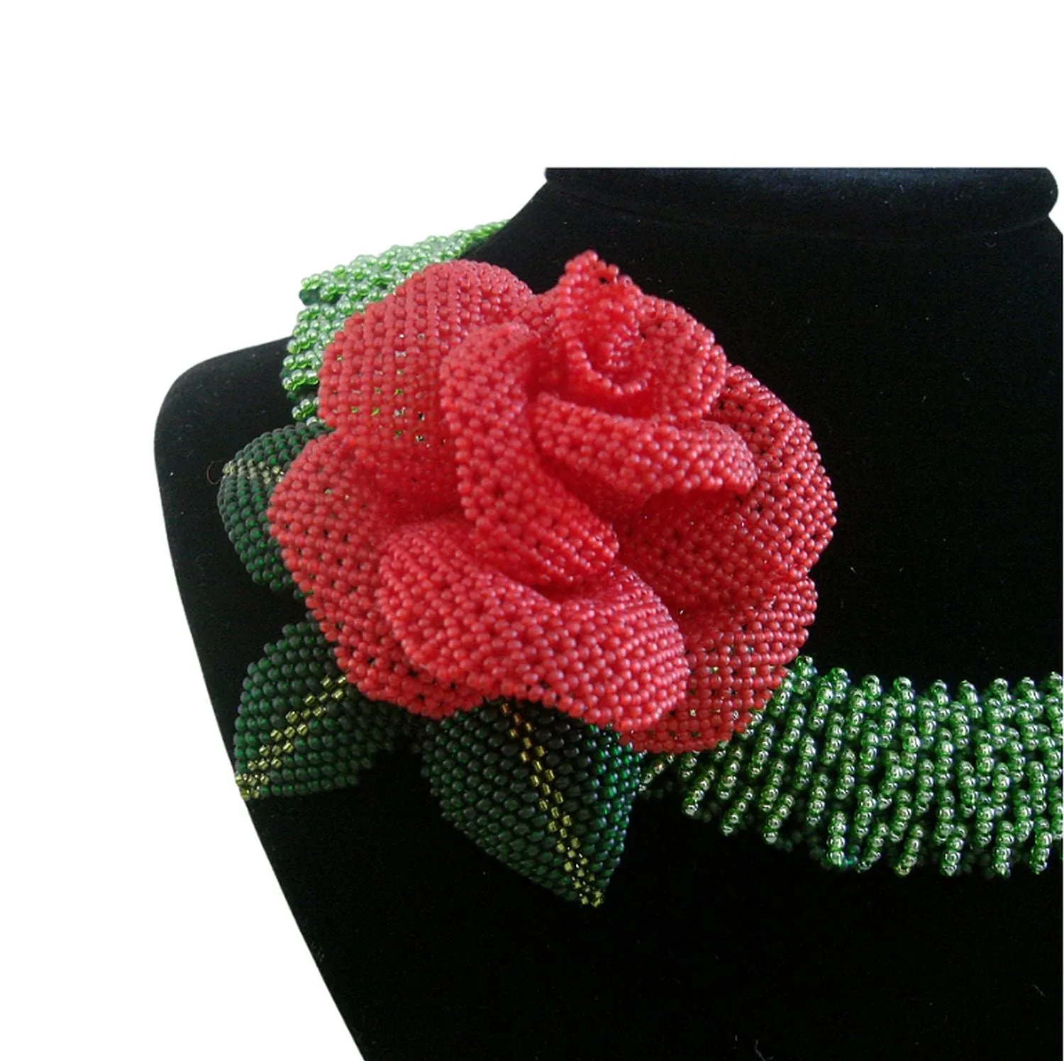Handmade green beaded necklace with red rose centerpiece.